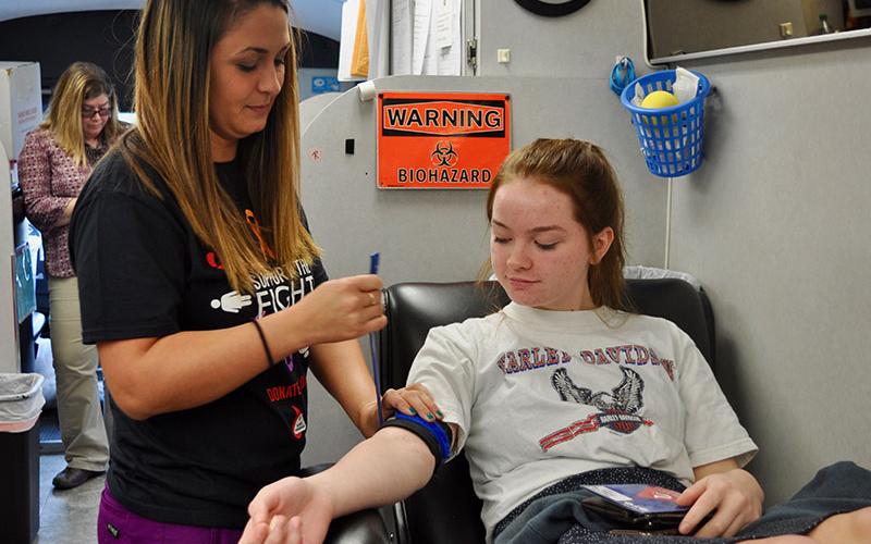 Donor Care Specialist Kristin Forrest preps Fannin County High School student Kimberly Wyant to give blood during Blood Assurance’s blood drive on the high school campus Friday, September 20.