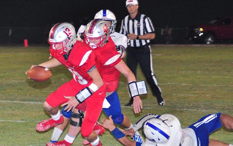 Copper Basin running back Chance Bailey (42) blocks as quarterback Bryson Grabowski (13) slips past a Sale Creek defender for a touchdown during Copper Basin’s game against the Panthers Friday, September 6.