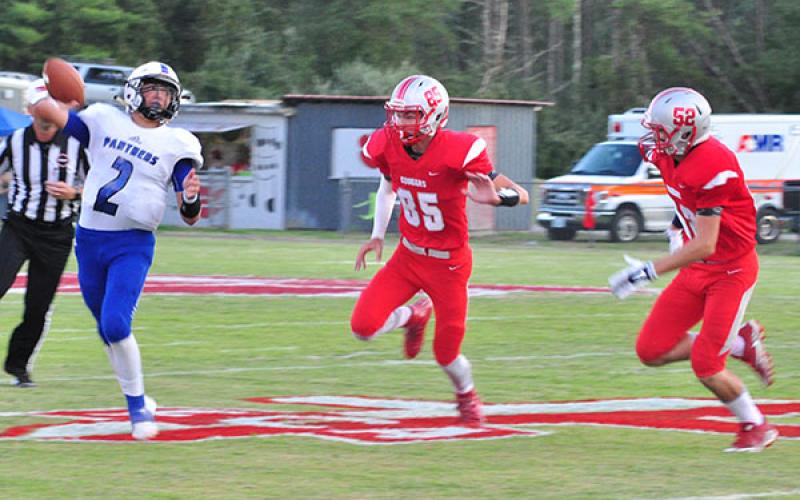 Copper Basin Cougars Cody Montgomery (85) and Larry Dye (52) bring pressure to the Sale Creek quarterback during Copper Basin’s game against the Panthers Friday, September 6.