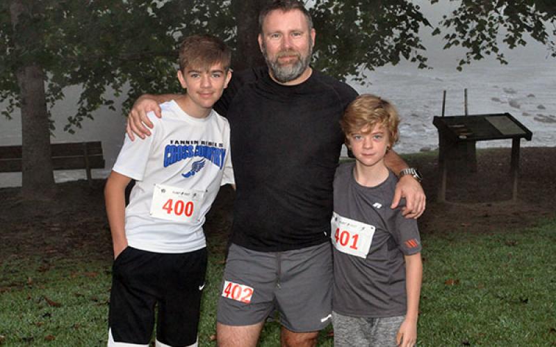 The Boys &amp; Girls Club of North Georgia hosted a Labor Day 5K River Run at Horseshoe Bend Park Saturday, August 31. Runners are pictured from left, James Bewley, J.P. Bewley and Johnathan Bewley.