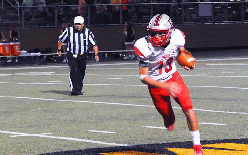 Cougar quarterback Bryson Grabowski (13) keeps the ball for a gain in recent action for Copper Basin. Grabowski set a new school passing record in the Cougar’s game against Andrews Friday, October 25.
