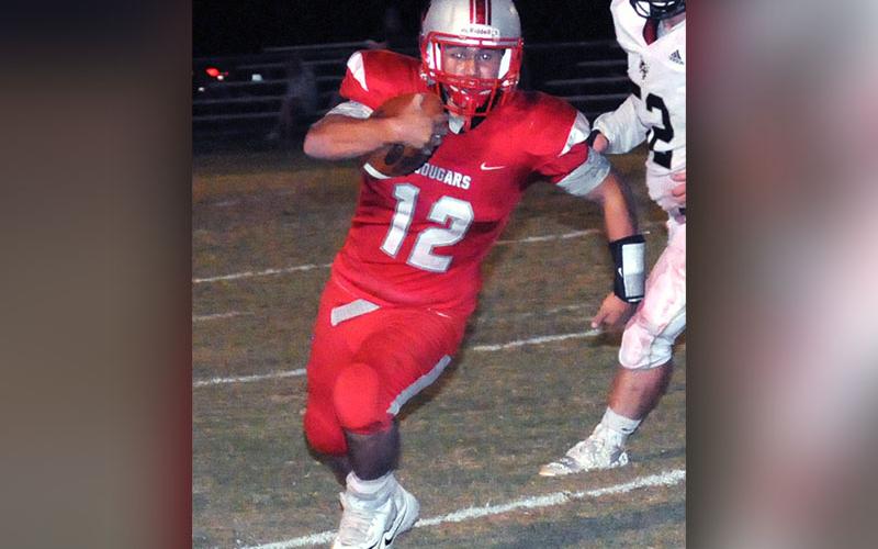 Copper Basin Cougar Sebastian Balilies (12) runs the ball into the red and white checkerboard endzone for a score during the Copper Basin’s region game with Lookout Valley Friday, October 4.