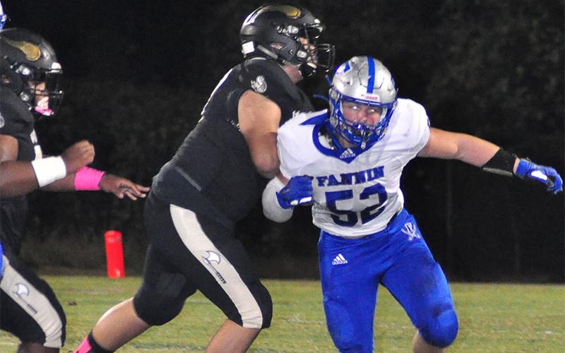 Rebel Micah O’Neal (52) fights through a defender to chase down the ball during the Rebels victory over East Hall Friday, October 11.