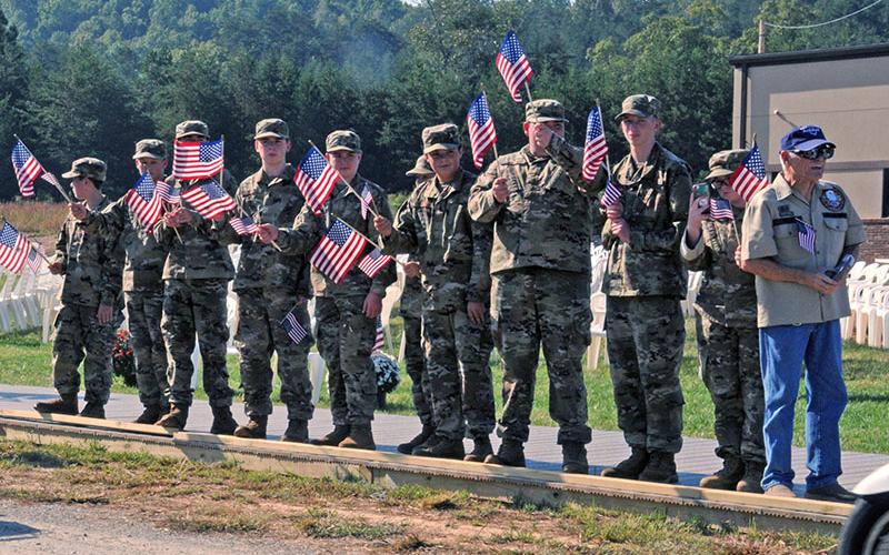 Members of the Junior ROTC program at Mountain Area Christian Academy were among the crowd welcoming The Vietnam Traveling Memorial Wall to Blue Ridge Thursday. Shown are, from left, Chase Roll, Wesley Tanner, Reagan Hooper, Ayden Gunsallus, Dawson Long, Willie Nickerson, Vance Coffey, Elijah Carroll, Ben Bargeron and Elizabeth Lee. The group also helped construct the Wall, which stood beside the Blue Ridge United Methodist Church from Thursday through Monday.
