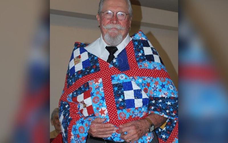 James Joldersma, from Mineral Bluff, served in the U.S. Air Force from 1966 to 1970 in the Vietnam War. Joldersma was awarded the National Defense Service Medal, the Good Conduct medal and a Marksman ribbon. He is shown with the Quilt of Valor he received from the Misty Mountain Quilters October 13.