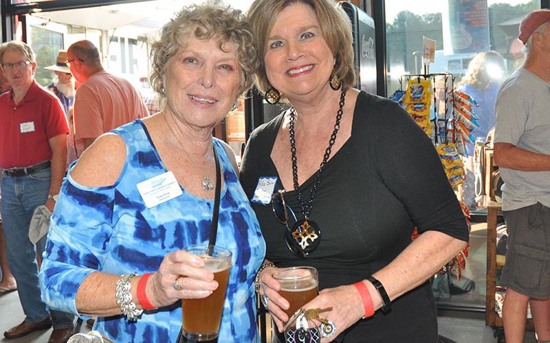 Pam Fink and Rita Suiter enjoy the recent Blues &amp; BBQ Festival kickoff party and chamber networking event at Grumpy Old Men Brewing, September 19.