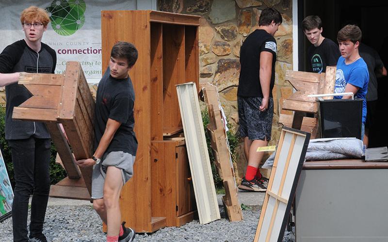 Fannin County High School football players and wrestlers helped move Family Connection to their new facility at the end of Industrial Park Road, September 27. Shown doing the heavy lifting are, from left, James Kinser, Grayson Patterson, Chris Scott, Austin Dobson and Colby Shaw.