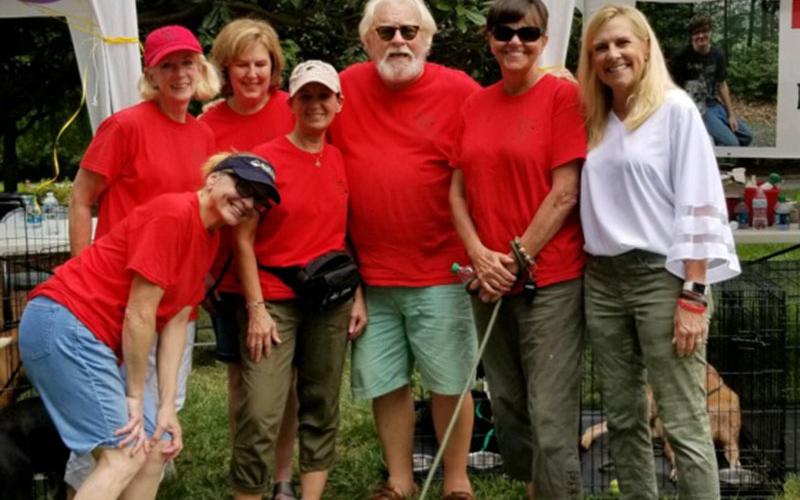 A group of rescue volunteers from Tri State Pet Rescue manned a booth and adopted out dogs at an adoption event held at the Georgia’s Governor’s mansion. Shown are, from left, Dana Worm, Elizabeth Young, Victoria McLaughlin, Carol Shannon, Kirk Williams, Jan Eaton and Georgia’s First Lady Marty Kemp.