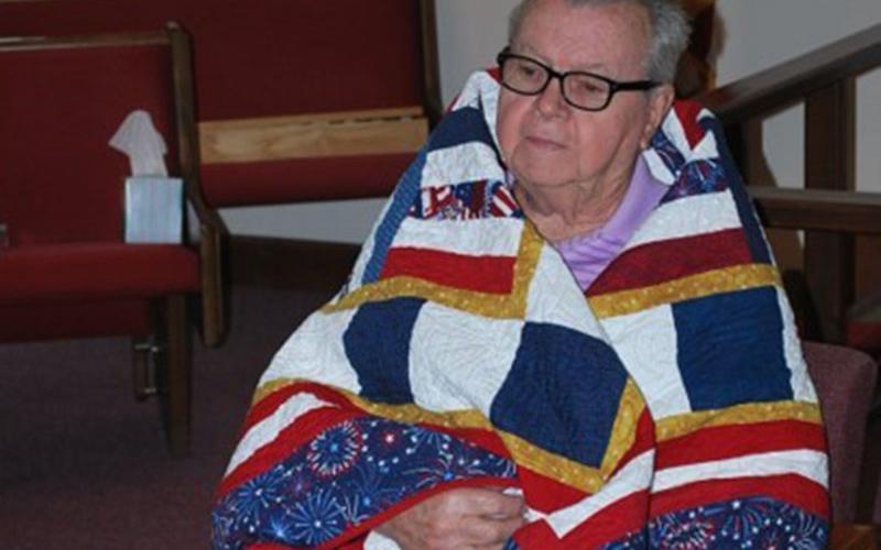 Quilt of Valor quilters Linda Gorman, Lula Williams and Sue Young from the Misty Mountain Quilters’ Guild in Blairsville were honored to award six Quilts of Valor to local veterans who have been touched by war. Kenneth Lee, from Morganton, shown here, served in the U.S. Navy and was deployed to the Korean Conflict. Kenny was in the Navy from 1954 through 1958. For his honorable service, Lee was awarded the Navy Good Conduct Medal.