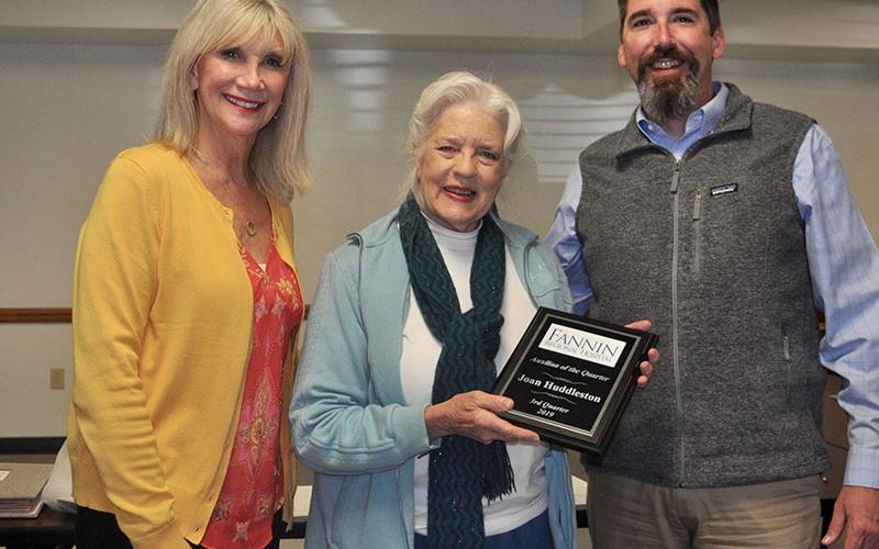 Fannin Regional Hospital Auxiliary member Joan Huddleston, middle, was recognized as the “Auxilian of the Quarter” during the auxiliary’s quarterly meeting Thursday, October 17. She is shown Fannin Regional Interim CEO Jason Jones and Director of Volunteer Services Susan Kiker.