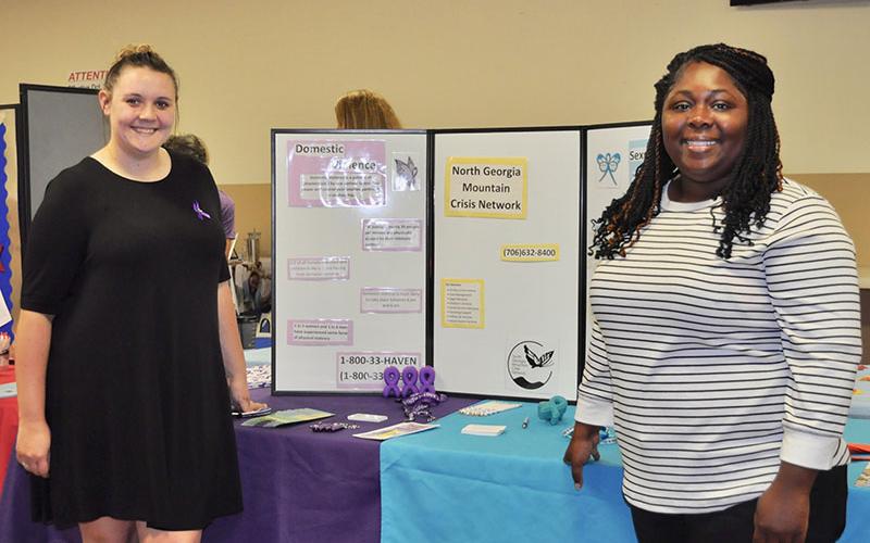 Community service organizations in Fannin and surrounding counties spoke to attendees of the 25th Annual Community Services Conference. Shown are Sarah Pirkle, left, and Whitley Carter from the North Georgia Mountain Crisis Network.