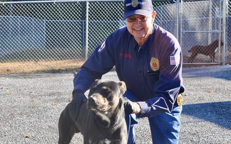 Animal Control Officer Pat Patterson poses with a male Lab mix named “Rowdy” who was found on Madola Road. He is staying at Fannin County Animal Control until reclaimed or adopted. This sweet boy has a beautiful black, tan and white coat. View this handsome guy under Animal Control number 314-19.