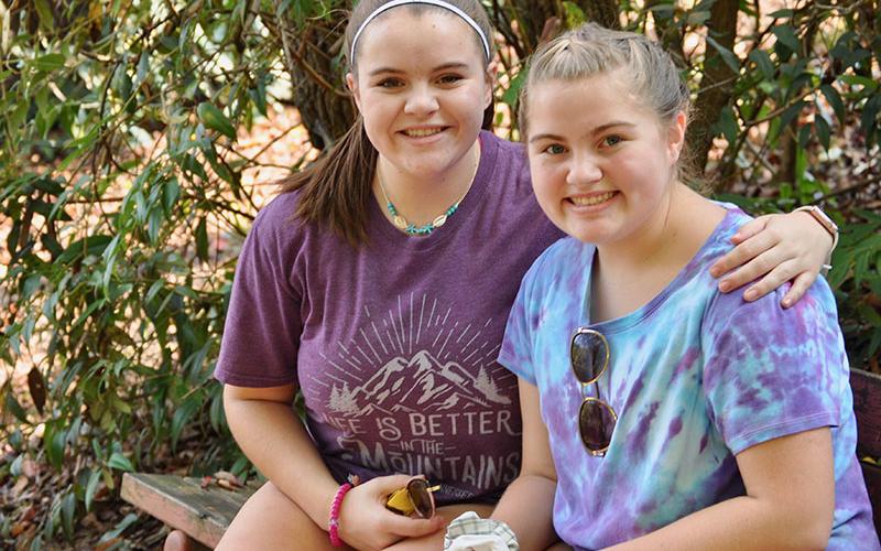Gracey Green, left, and Hollyanna Green sat on a bench next to the Toccoa River as they waited for the race to begin at the Boys &amp; Girls Clubs of North Georgia’s annual Great 515 Duck Derby.