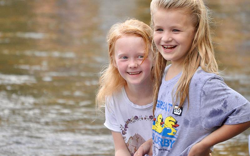 Eva Raque, left, and Harper Beadnell were excited to catch the first glimpse of the rubber ducks racing down the Toccoa River during the Boys &amp; Girls Clubs of North Georgia’s annual Great 515 Duck Derby.