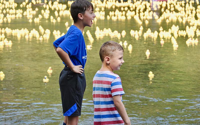 Ryder Jones, left, and River Rayborn watched as a sea of rubber ducks raced to the finish line at the Boys &amp; Girls Clubs of North Georgia’s annual Great 515 Duck Derby Saturday, September 28.