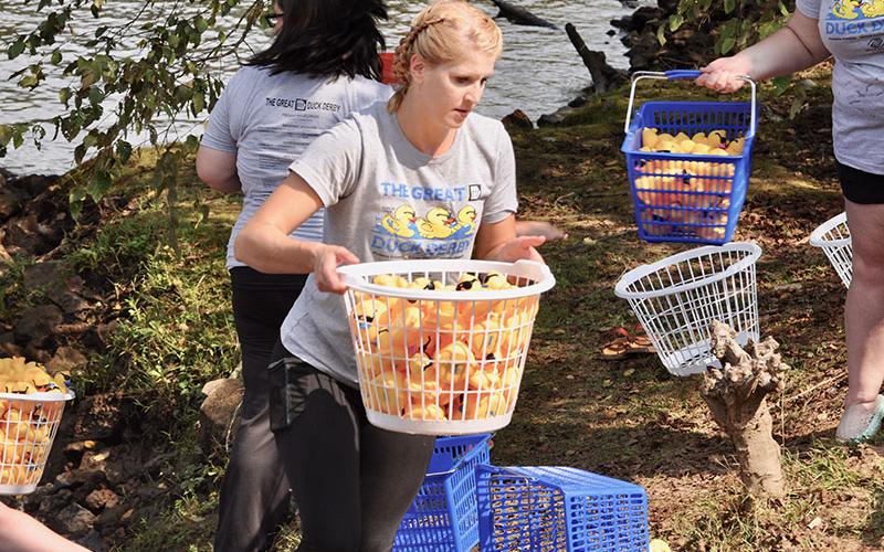 Brittany Byess helped the Boys &amp; Girls Clubs of North Georgia collect rubber ducks from the Toccoa River at the conclusion of the annual Great 515 Duck Derby at Ron Henry Horseshoe Bend Park.