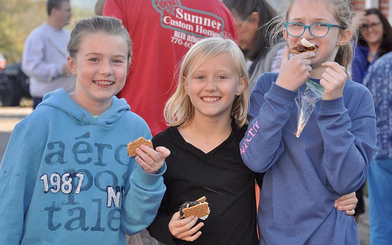 East Fannin Elementary School students chowed down on some s’mores during the school’s literacy night Wednesday, October 16. Shown are, from left, Tabor Pass, Claire Saxon, and Karleigh Stiles.