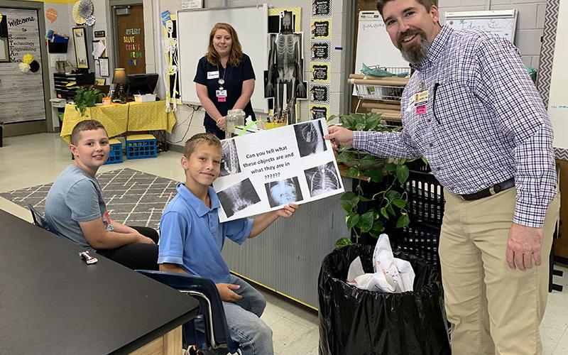 Fannin Regional Hospital partnered with West Fannin Elementary School to teach fifth grade students about a variety of medical subjects including bone health. Students, from left, Eli Queen and Isaiah Dell are shown with Imaging Director Amy Hughes and Interim CEO Jason Jones.