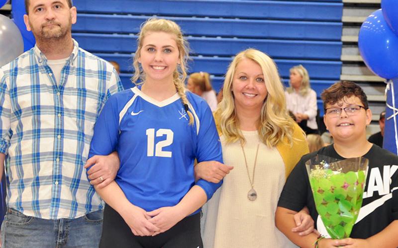 Lady Rebel Hannah Green was escorted by members of her family during Fannin County High School Volleyball team’s Senior Night. Shown are, from left, Tim Green, Green, Crystal Clore and Aydan Hensley.