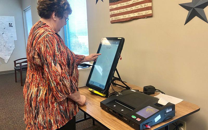 Fannin County Election Supervisor Mary Ann Conner tests one of Georgia’s new voting machines. The Board of Elections office invites Fannin County citizens to try out the machine before the next election.