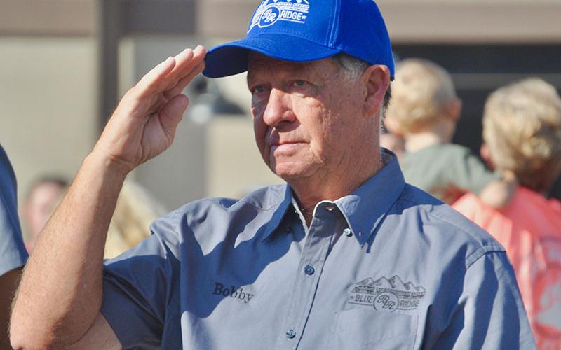 Vietnam Veteran and Fannin County Board of Education member Bobby Bearden salutes the fallen during the playing of Taps at The Vietnam Traveling Memorial Wall memorial service Friday, October 4.