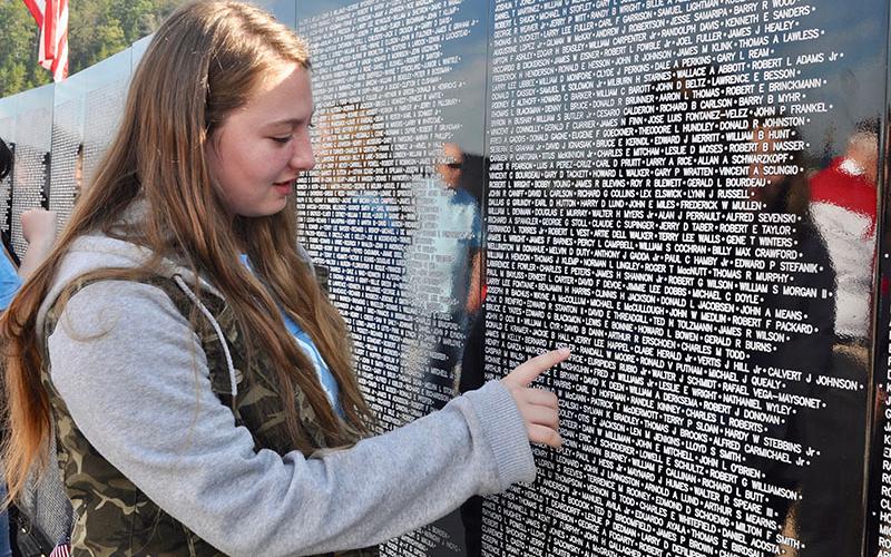 Fannin County Middle School student Haley Thompson visits the The Vietnam Traveling Memorial Wall with her fellow classmates during its residency in Blue Ridge.