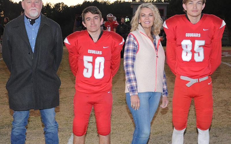 Senior Cougars Jacob Montgomery (50) and Cody Montgomery (85) were honored at Copper Basin’s senior night Friday, November 1. They are shown with their parents Johnny and Penny Montgomery.