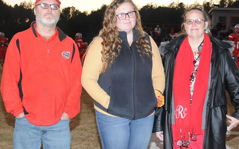 Senior Lady Cougar golfer Alaura Rollins is shown with her parents Tony and Amanda Rollins. Rollins was honored at the senior night ceremonty Friday, November 1.