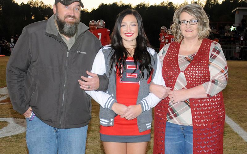Senior Lady Cougar cheerleader Anna West is shown with her parents Daniel and Amanda West during Copper Basin’s senior night Friday, November 1.