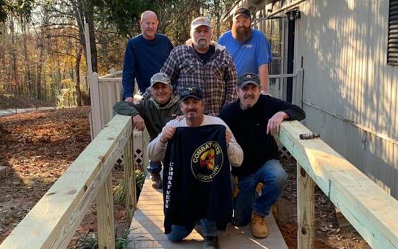 Members of the Combat Veterans Motorcycle Association worked to build a much needed wheelchair ramp for fellow veteran Roger Dionne. Shown on the completed ramp are, from left, front, Bob Renneke, Rob Denison and Paul Hogue; back, Steve Continenza, Dionne and Steve Continenza.