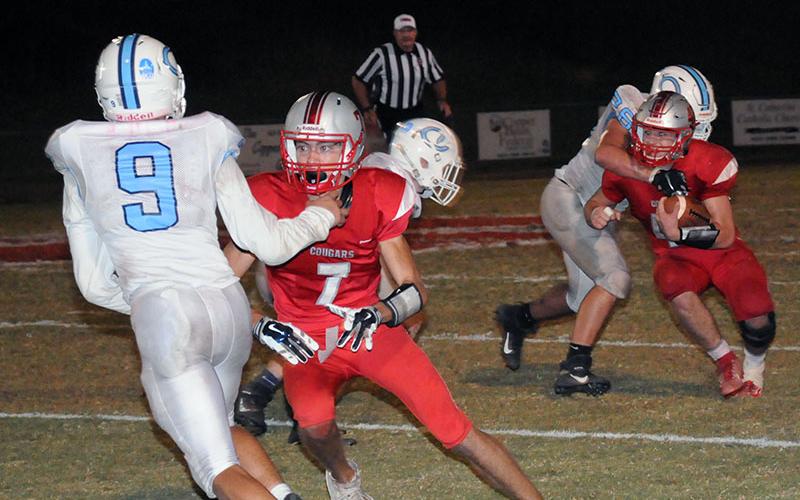 Cougar Dawson Worthy (7) blocks for runningback Chance Bailey (42) in recent action for the Copper Basin.