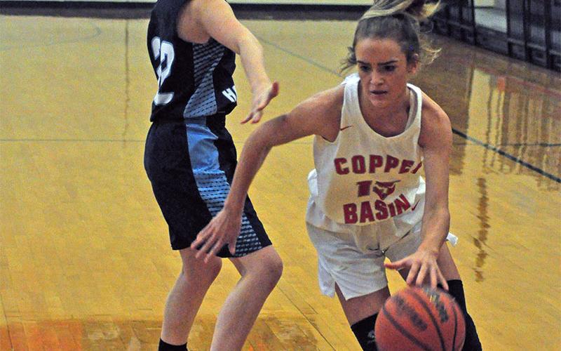 Lady Cougar Riley Smith explodes past a Lady Hawks defender during Copper Basin’s win against Nantahala Thursday, November 21.