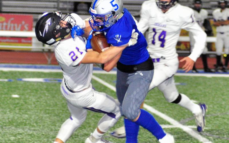 Fannin Rebel Seth Reece (5) plows through a defender during the Rebels region win against Lumpkin County Friday, November 1.