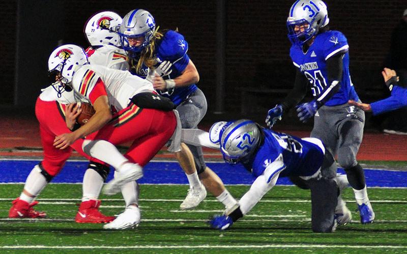 Fannin Rebels Jackson Weeks (54), Micah O’Neal (52) and Campbell Cosentino (31) swarm towards the ball carrier during the Rebels region match with GAC Friday, November 8.