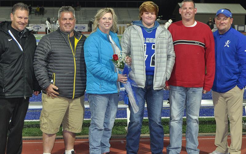 Senior football player Gabe Willis was honored before the Rebels football game against GAC Friday, November 8. Shown are, from left, Jeremy Fehrenbach, Tara Fehrenbach, senior Gabe Willis, Chad Willis and FCHS football coach Chad Cheatham.