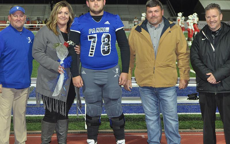 Fannin County High School senior Miles Johnson was one of the football seniors honored before the Rebels game against GAC Friday, November 8. Johnson is shown with his parents, Leslie Mann and Earl Johnson.