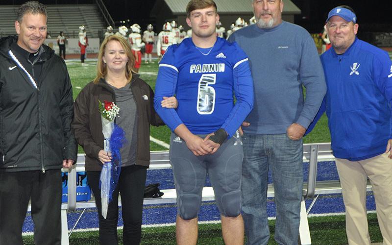 FCHS senior Jakob Tuggle was honored before the Rebels played Greater Atlanta Christian Friday, November 8. Tuggle is shown with his parents Sandi and David Tuggle.