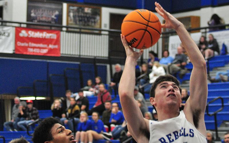 Fannin Rebel Brady Martin fights to get a shot off in recent action for the Fannin County Rebels.