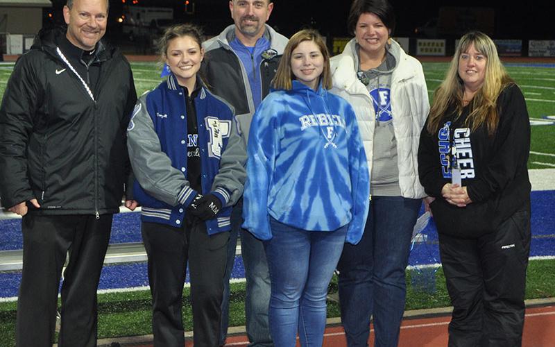 Four senior Lady Rebel cheerleaders were recognized at Fannin County’s senior night Friday, November 8. Shown are, from left, senior Morgan Mull, Michael Mull, father; Madison Mull, sister; and Betsy Mull, mother.