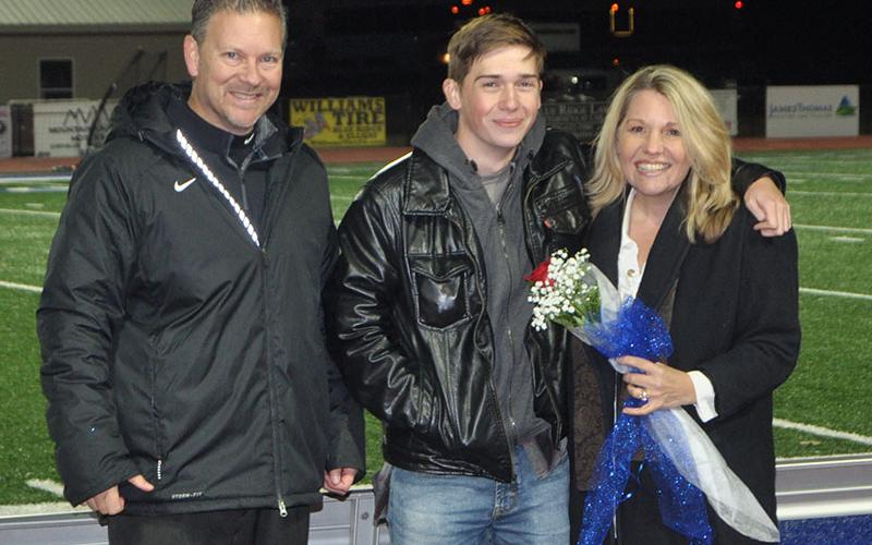 Fannin County cross country senior Nick Leymeister was honored at Fannin’s last home game of the season Friday, November 8. He is shown with principal Erik Cioffi and Christine Callihan.
