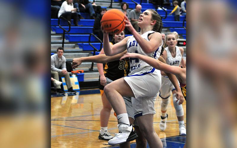 Lady Rebel Abby Ledford fights through the Murphy defenders during the Lady Rebels basketball scrimmage with the Lady Bulldogs Thursday, November 14.