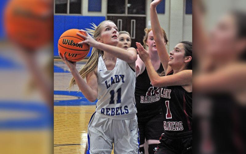 Senior Lady Rebel Saidee Collins fights through contact to shoot a layup during the Lady Rebels game against the Lady Raiders Tuesday, November 19.