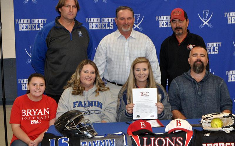 Senior Lady Rebel softball player Kayleigh Russell signed a scholarship to further her athletic and academic career at Bryan College in Dayton, Tennessee. Shown following the ceremony are, from left, front, Kelsey Russell, sister; Tina Russell, mother; Kayleigh Russell, Justin Russell, father; and back, FCHS head softball coach Alan Collis, travel ball coach Steve Young and Bryan College assistant softball coach Pete Massengale.