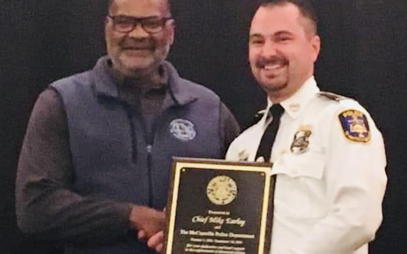 McCaysville Police Chief Michael Earley, right, is shown receiving an award from Allen Poole, director of the Georgia Governor’s Office of Highway Safety.