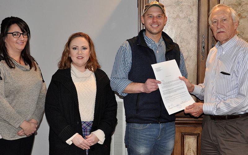 Dr. Bill Whaley presents the deed to his and wife June’s land as a donation to the Habitat for Humanity of Fannin &amp; Gilmer counties Monday, November 18. Shown, from left, are Shannon Davenport, Attorney Laura J. Ray, Habitat Executive Director Chris Hall and Whaley.