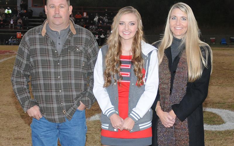 Senior cheerleader Regan Holder was recognized at the senior night ceremony at Copper Basin Friday, November 1. Holder is shown with her parents John and Bobbi Holder.