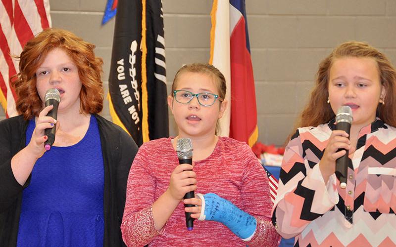 Blue Ridge Elementary School students sang the Star Spangled Banner during the school’s Veterans Day Ceremony Friday, November 8. Shown are, from left, Mya Hill, Tatum Ledford and Cassidy Walden.