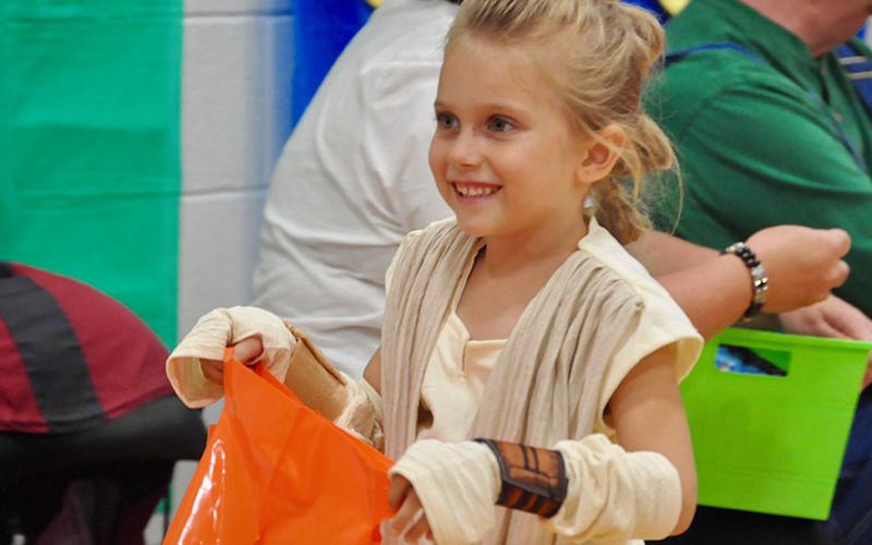 East Fannin Elementary School student Emmalynn Smisson trick-or-treats as Rey from Star Wars during the school’s Halloween event Thursday, October 31.