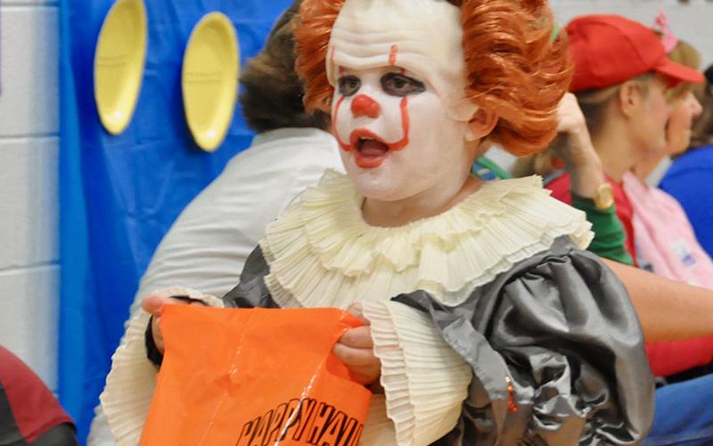 Carson Zimmerman gives people a fright as Pennywise the clown during East Fannin Elementary School’s trick-or-treating event.