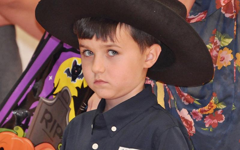 Cowboy Logan Shelton trick-or-treats with his family at East Fannin Elementary School’s Halloween event Thursday, October 31.
